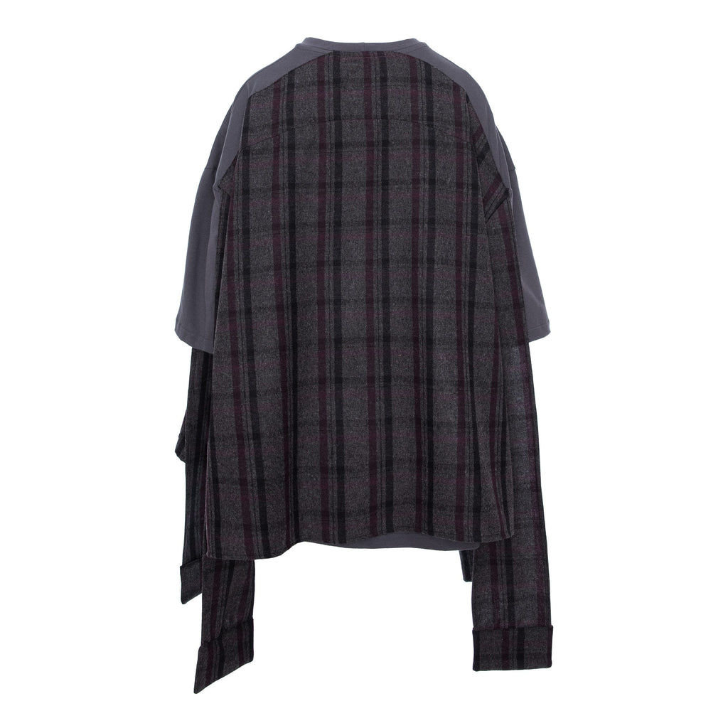 A dark gray and black plaid poncho-style top with solid dark gray sleeves, shown from the back against a plain white background.