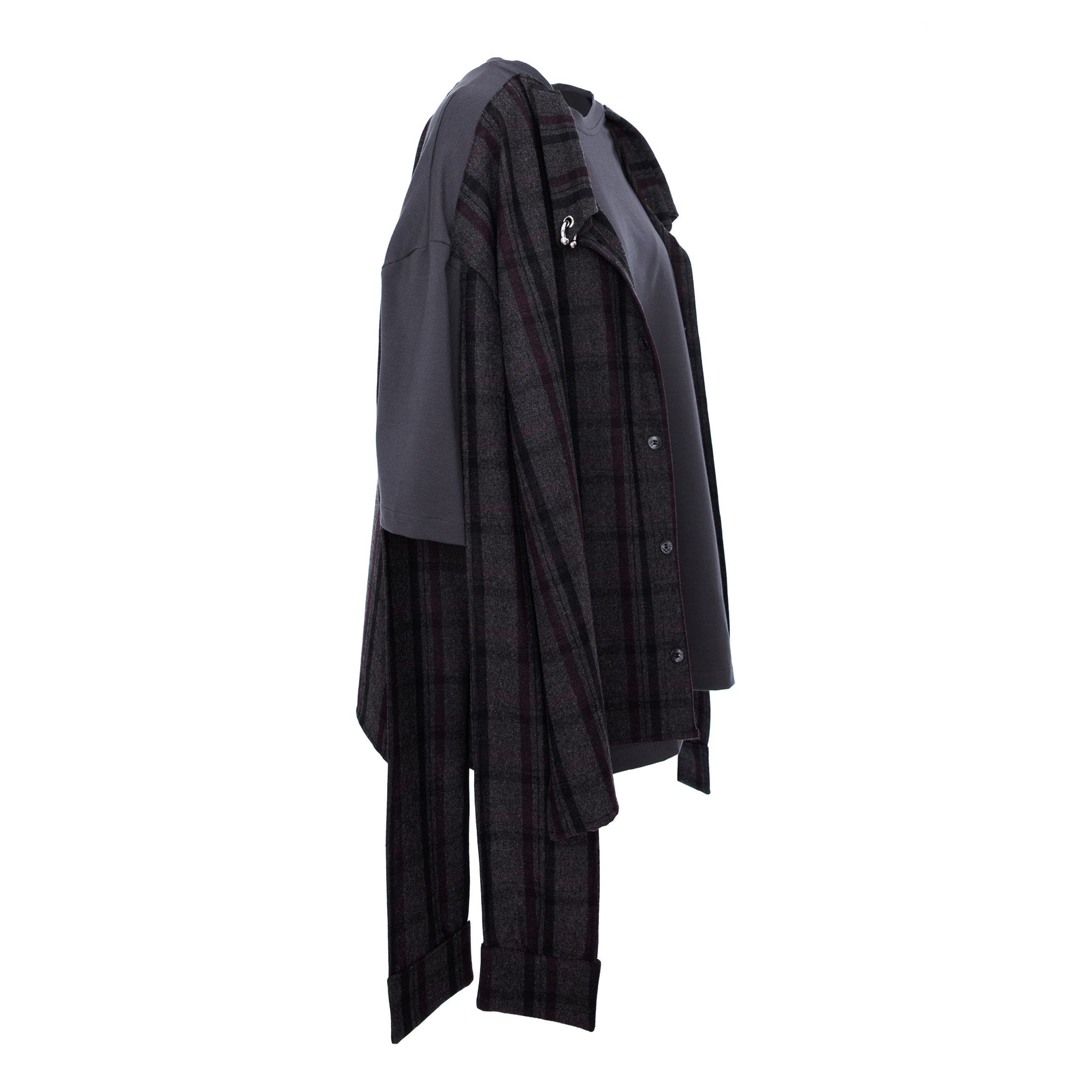 A dark gray and black plaid button-up shirt with contrasting solid dark gray sleeves, shown from the side against a plain white background.