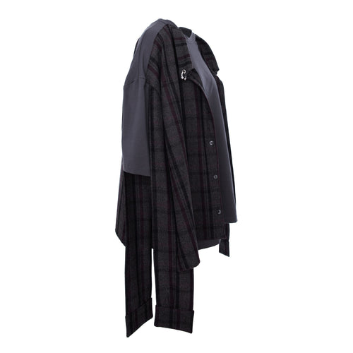 A dark gray and black plaid button-up shirt with contrasting solid dark gray sleeves, shown from the side against a plain white background.