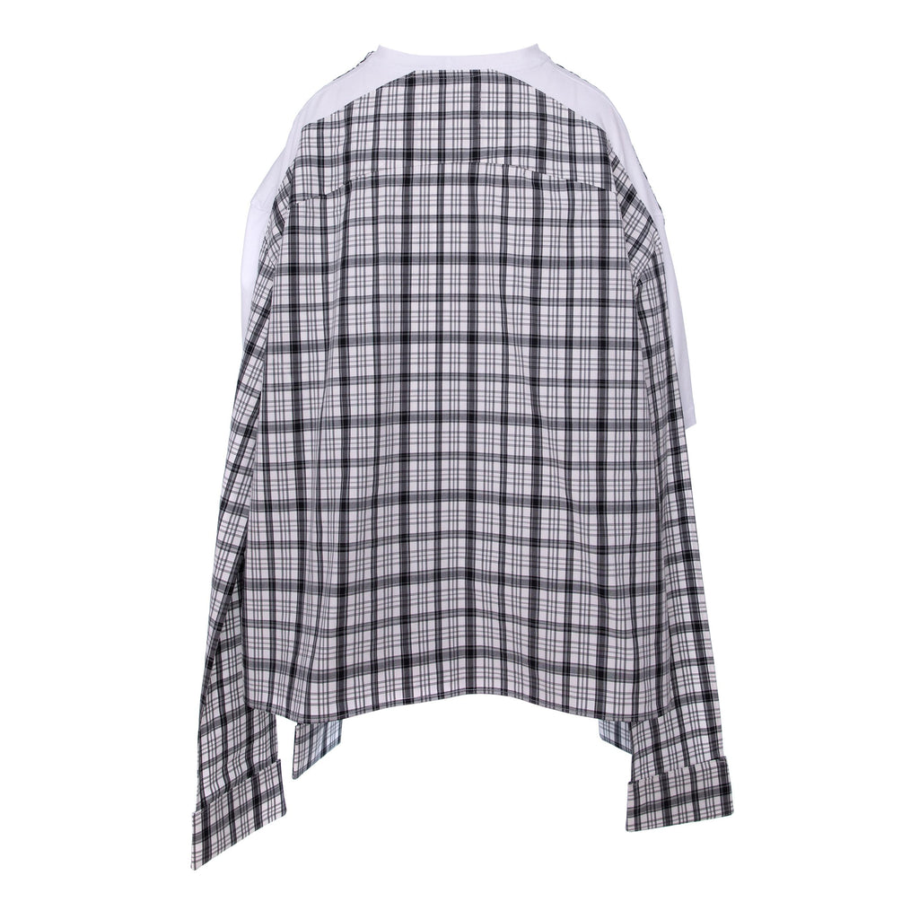A long-sleeve plaid shirt with a black, white, and gray checkered pattern, featuring contrasting solid white shoulder yokes and a high-low hemline.