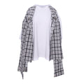 A black and white plaid shirt jacket styled open over a white t-shirt, presented on a clean white background.