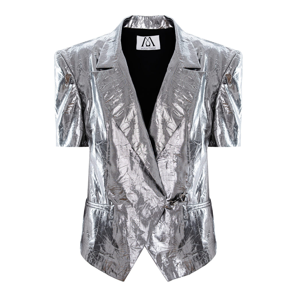 A metallic silver short-sleeve blazer with a crinkled, textured finish, featuring notch lapels, a wrap-style front, and a black inner lining, shown against a plain white background.