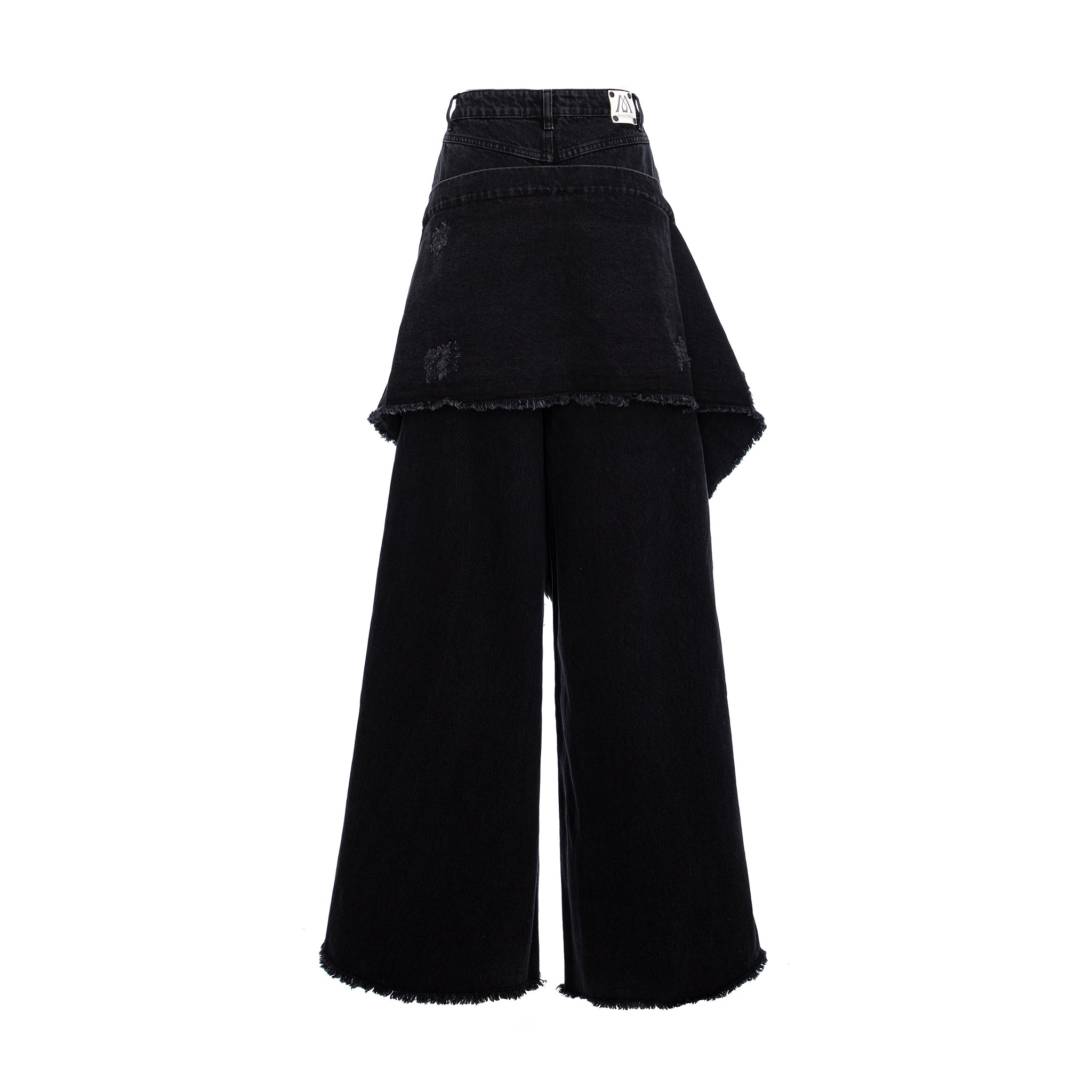 Black wide-leg denim pants with a layered, asymmetrical ruffle overlay and raw frayed hems, shown against a plain white background.