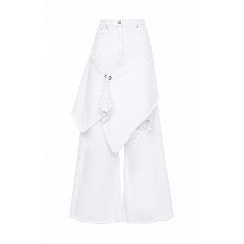 White wide-leg denim pants with an asymmetrical draped overlay and distressed details, shown against a plain white background.