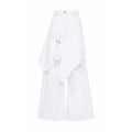 White wide-leg denim pants with an asymmetrical draped overlay and distressed details, shown against a plain white background.